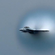 Illustration for article titled An FA-18 Emerges From A Transdimensional Wormhole Over Detroit